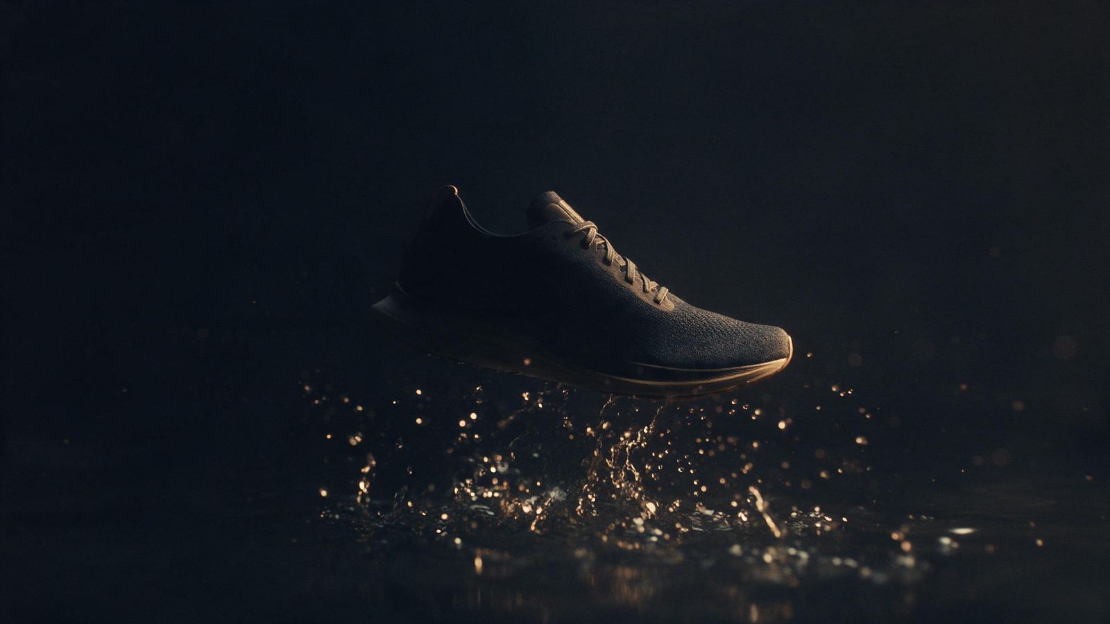 Commercial still: a glass perfume bottle in dramatic light